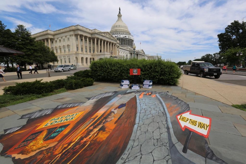 The press conference took place at the step s of the U.S. Capitol and featured a pit of despair that depicts what borrowers encounter when they take out payday loans.